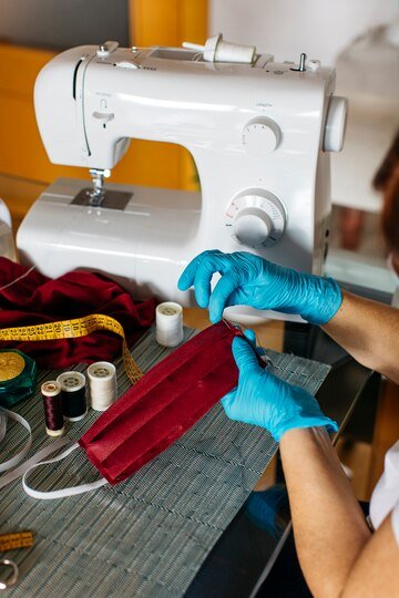 close-up-view-woman-s-hands-sewing-face-mask_24837-360